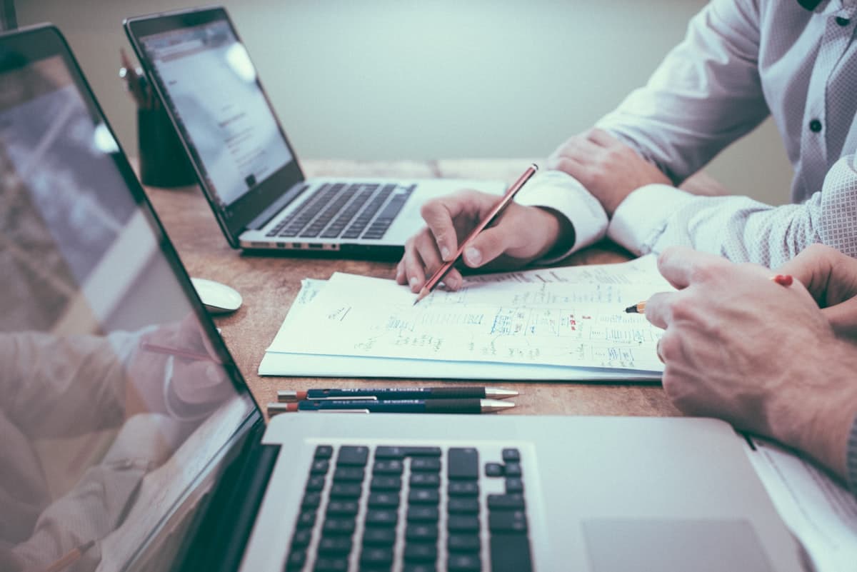 Professional reviewing documents at a clean desk setup